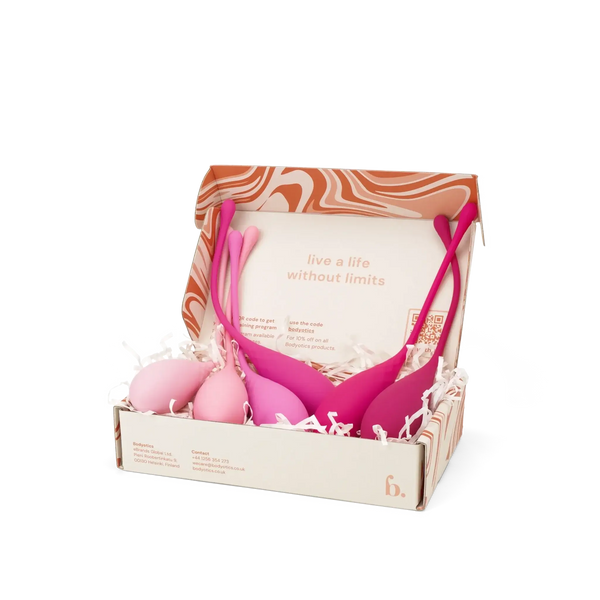 Bodyotics Kegel balls set with six graduated pelvic wellness weights in pink shades, packaged in a decorative box.