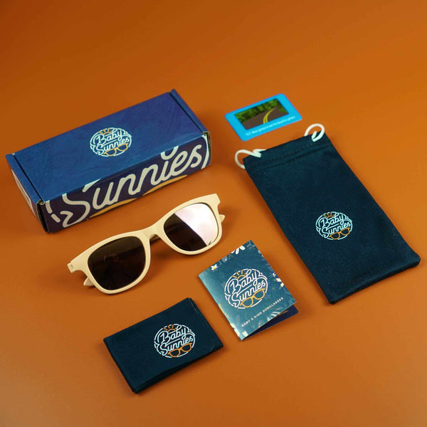 Peach flexible polarized kids sunglasses with eco-friendly packaging, suitable for ages 3-8, offering 100% UV protection.